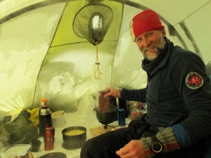 Vegard Ulvang preparing food in a tent