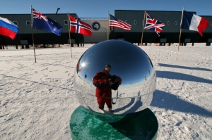 The globe at the South Pole, with the Amundsen-Scott station in the background