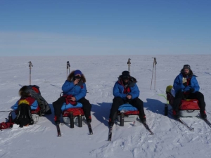 Three skiers having lunch at the Ross ice shelf.
